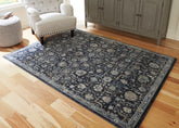 Warmstead Furniture - Ashley Furniture - Hilcott Rug - 5'3" x 7'3" Rug / Blue/Cream/Brown - R406112